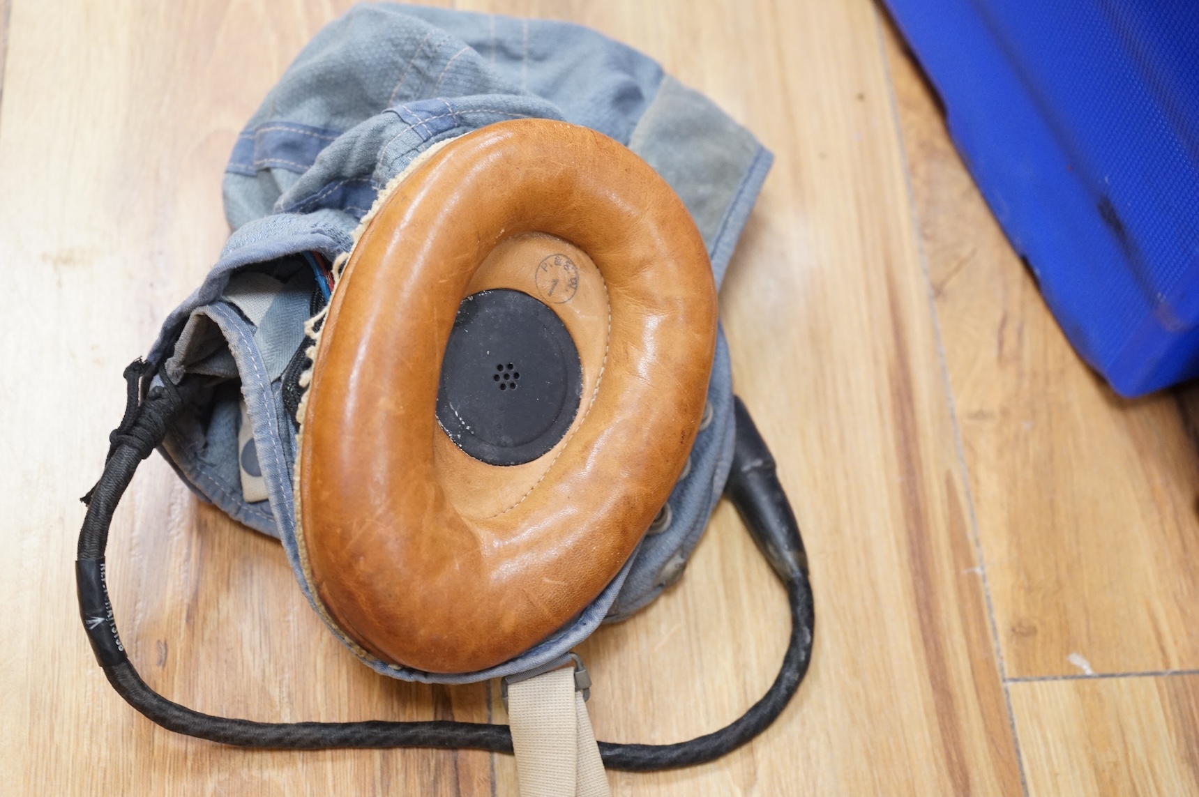 An early British jet aircraft RAF flying helmet, size 3 regular, dated 1958, with visor and visor cover, and original interior webbing, complete with inner cloth flight cap with built-in headphones and electrics and date
